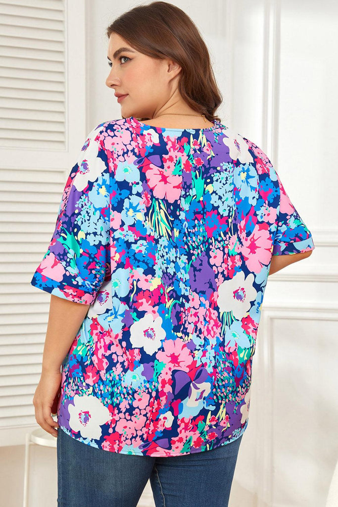 Floral Center Seam V-Neck Blouse (Online Only) - Made by Trendsi , available in , located in Panama City, FL.