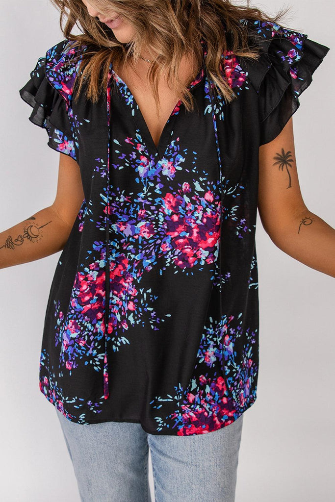 Floral Tie-Neck Flutter Sleeve Blouse (Online Only) - Made by Trendsi , available in black, bright, floral, pink, purple , located in Panama City, FL.