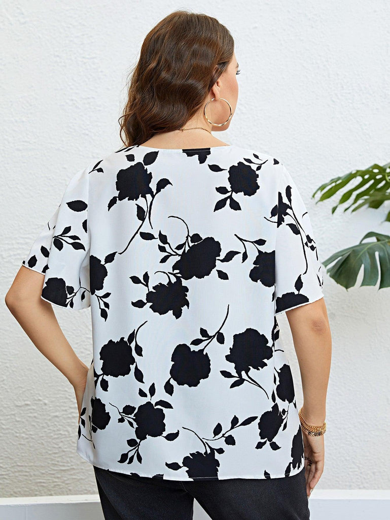 Floral V-Neck Flutter Sleeve Blouse (Online Only) - Made by Trendsi , available in , located in Panama City, FL.