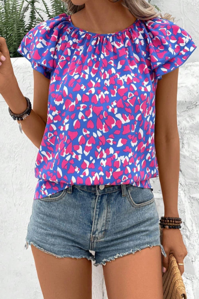 Printed Round Neck Flutter Sleeve Blouse (Online Only) - Made by Trendsi , available in exclusive, june, online, pink, print, purple, Ship From Overseas, Short Sleeve, sleeveless , located in Panama City, FL.